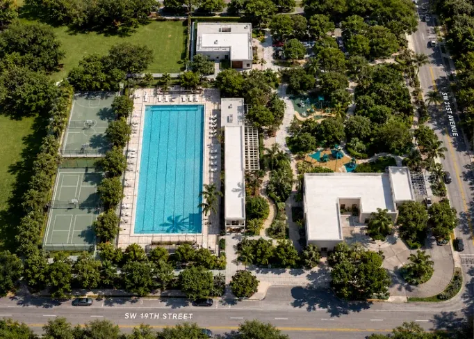 Aerial view of Shenandoah Park — the swimming pool, tennis courts and tree canopy along SW 19th Street